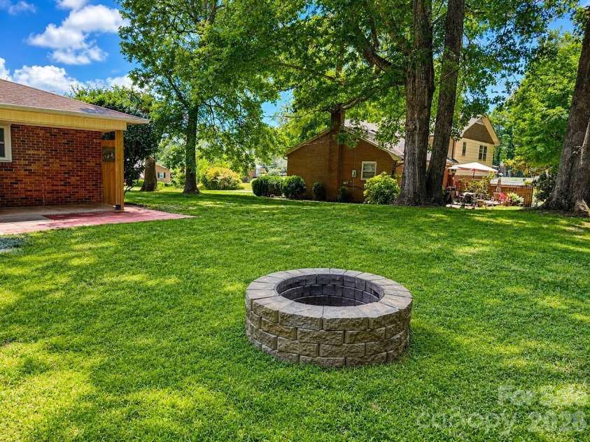 706 Hedrick Drive, Statesville, NC 28677.  MLS# CAR4399406, YatesRealty ID 35168. Firepit