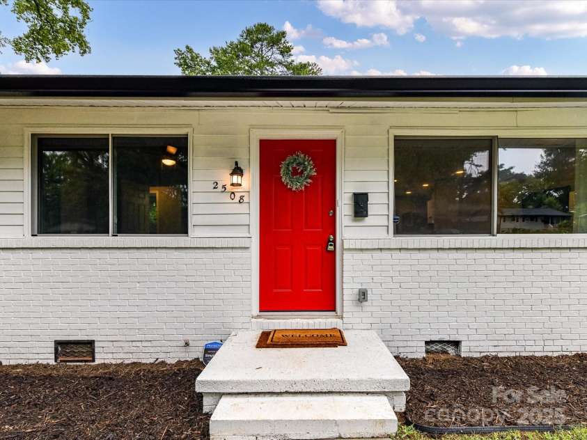 2508 Carrington Court, Charlotte, NC 28208.  MLS# CAR4288824, YatesRealty ID 35169. A gorgeous red door greets you as you enter
