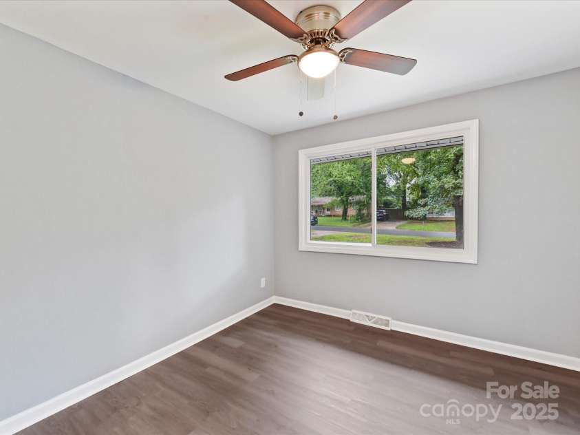 2508 Carrington Court, Charlotte, NC 28208.  MLS# CAR4288824, YatesRealty ID 35169. Bedroom 2 with LVP continued throughout the home