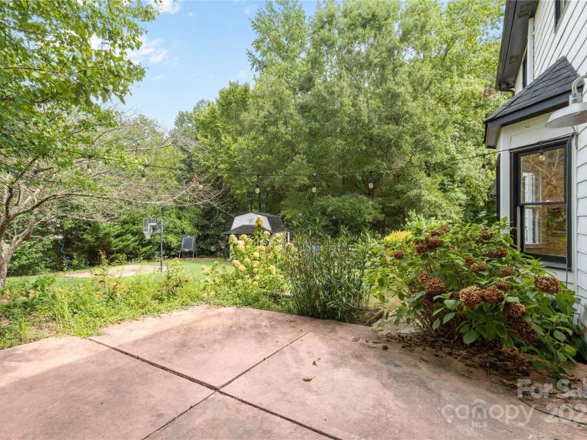 2359 Fernridge Lane, Matthews, NC 28105.  MLS# CAR4296338, YatesRealty ID 35175. Patio in back yard perfect for grilling