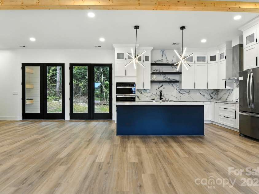 303 Wittenburg Springs Drive, Taylorsville, NC 28681.  MLS# CAR4284658, YatesRealty ID 35178. Living, , dinning and kitchen