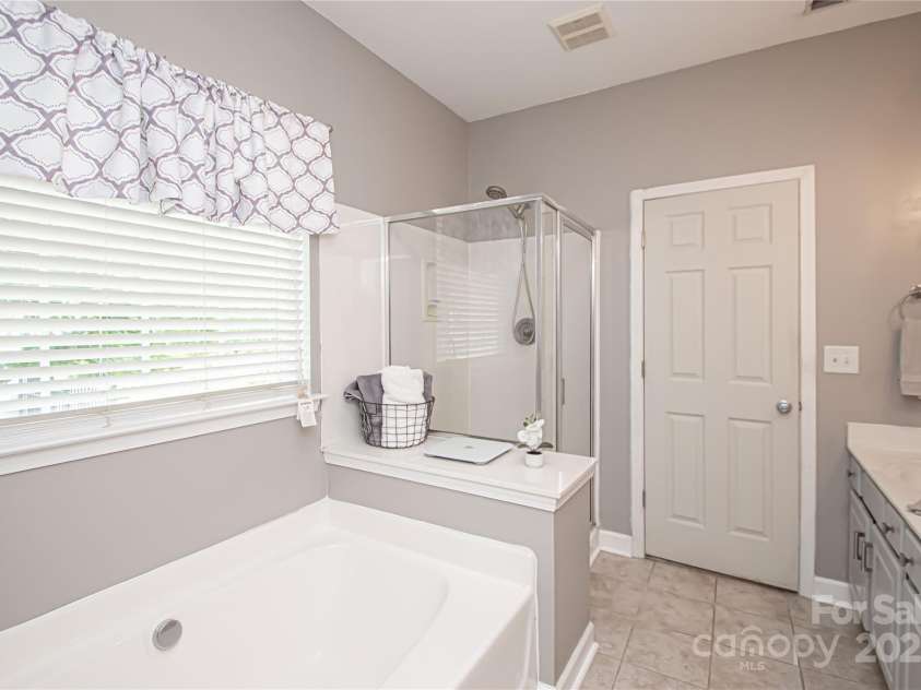 1304 Hammond Drive, Matthews, NC 28104.  MLS# CAR4289599, YatesRealty ID 35179. Primary Bathroom