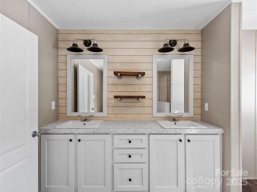 392 Burnsville School Road, Burnsville, NC 28714.  MLS# CAR4211732, YatesRealty ID 3518. Double vanity in Primary bathroom