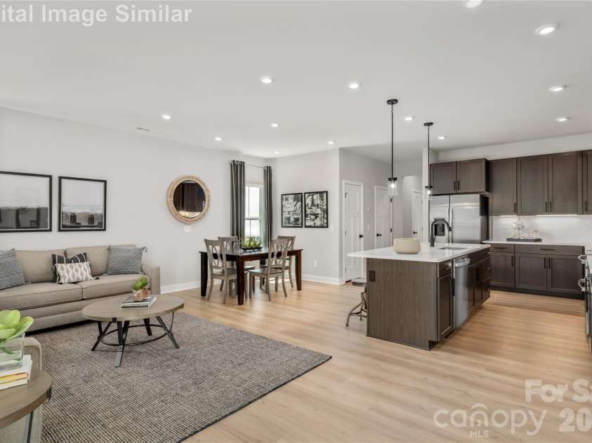 9568 Teamwork Street, Concord, NC 28027.  MLS# CAR4400105, YatesRealty ID 35180. Whether You're Whipping Up A Weeknight Favorite or Hosting A Weekend Dinner Party, The Seamless Flow Between Kitchen, Dining, And Living Areas Keeps You Connected to Every Moment And Everyone In It.