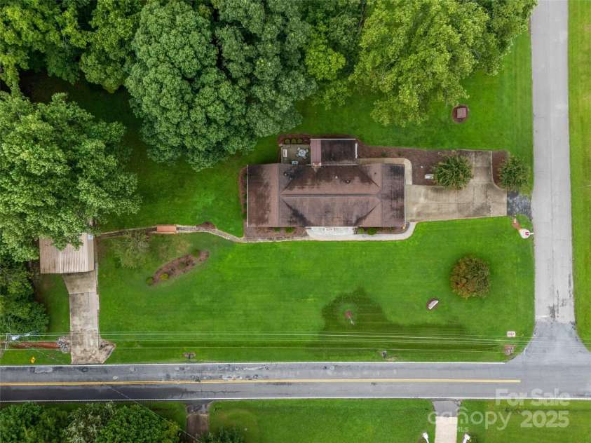 1945 Jim McCarter Road, Clover, SC 29710.  MLS# CAR4272277, YatesRealty ID 35184. Arial view of home and lot