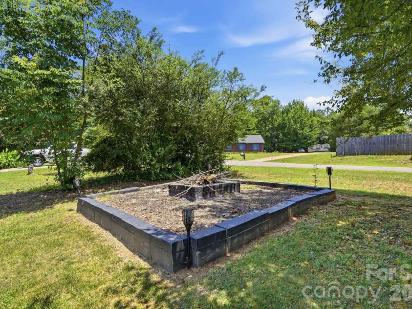 107 Brendle Lane, Troutman, NC 28166.  MLS# CAR4398086, YatesRealty ID 35188. Firepit