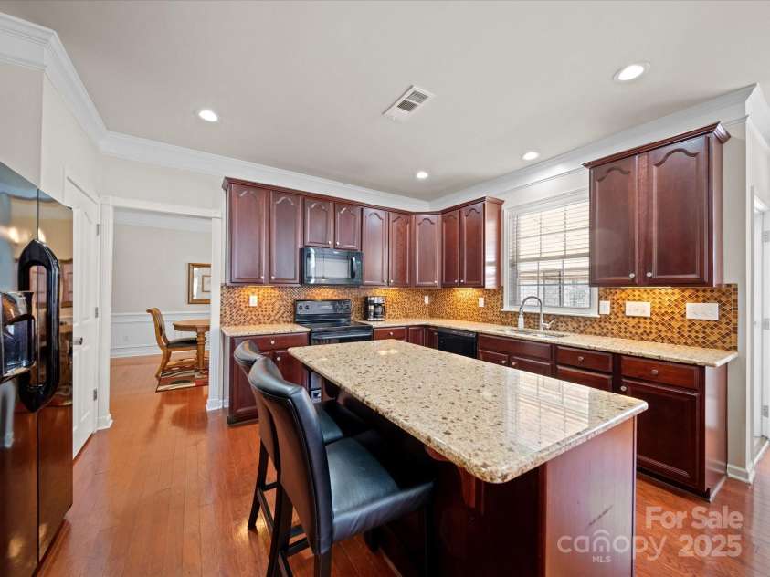 7719 Whisperingwood Drive, Harrisburg, NC 28075.  MLS# CAR4237557, YatesRealty ID 3519. Kitchen