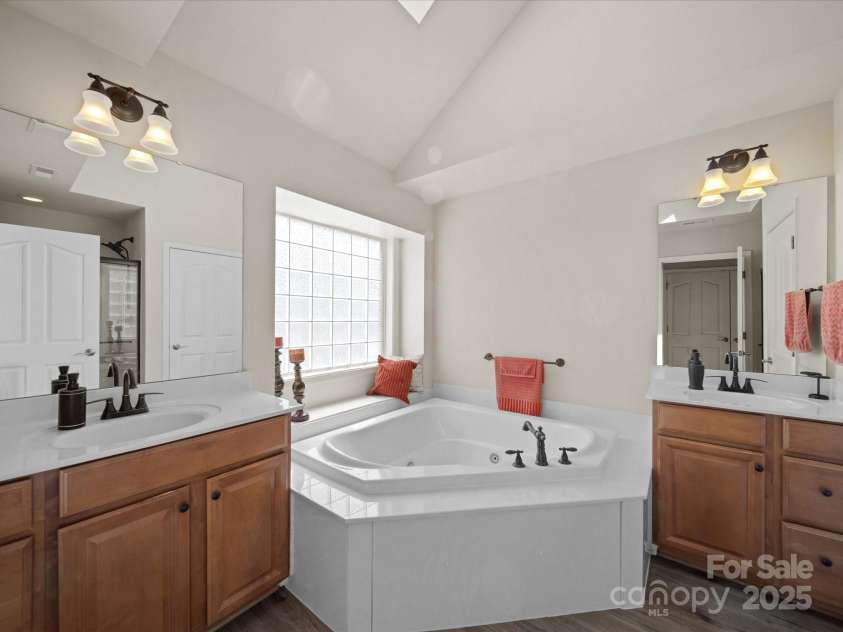 7719 Whisperingwood Drive, Harrisburg, NC 28075.  MLS# CAR4237557, YatesRealty ID 3519. Primary bath