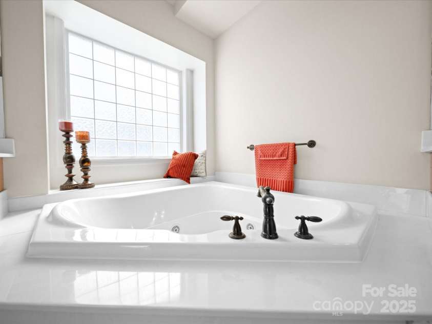 7719 Whisperingwood Drive, Harrisburg, NC 28075.  MLS# CAR4237557, YatesRealty ID 3519. Primary Bath