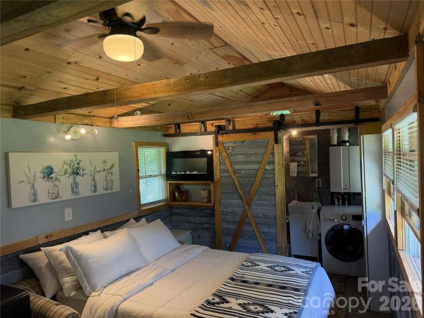 38 Lloyd Barnwell Road, Hendersonville, NC 28792.  MLS# CAR4394211, YatesRealty ID 35210. Beautiful ceilings, barn door so quaint and nice.