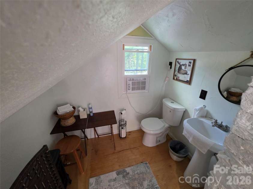 38 Lloyd Barnwell Road, Hendersonville, NC 28792.  MLS# CAR4394211, YatesRealty ID 35210. Convenient half bathroom located in the spacious upper sleeping loft.