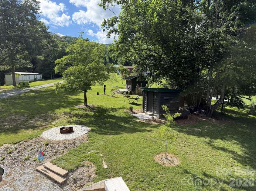 38 Lloyd Barnwell Road, Hendersonville, NC 28792.  MLS# CAR4394211, YatesRealty ID 35210. Fire pit