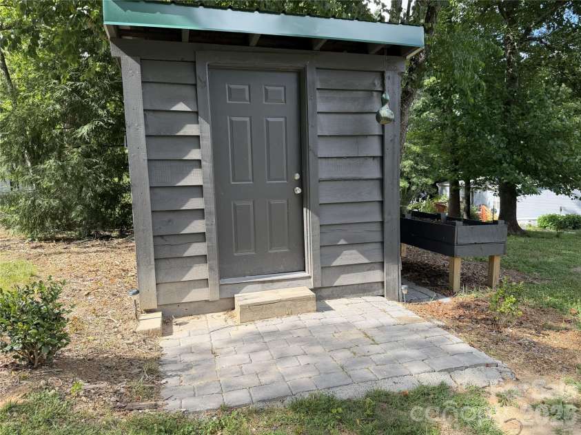38 Lloyd Barnwell Road, Hendersonville, NC 28792.  MLS# CAR4394211, YatesRealty ID 35210. Storage Shed