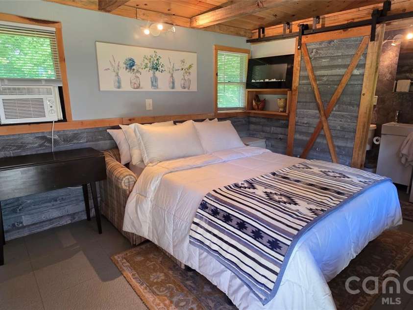 38 Lloyd Barnwell Road, Hendersonville, NC 28792.  MLS# CAR4394211, YatesRealty ID 35210. Tiny house bed and bath