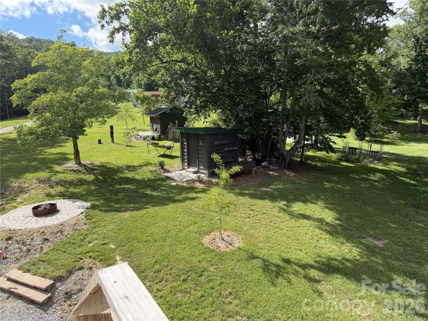 38 Lloyd Barnwell Road, Hendersonville, NC 28792.  MLS# CAR4394211, YatesRealty ID 35210. View from the upper deck! Tiny house and 1.68 acres.