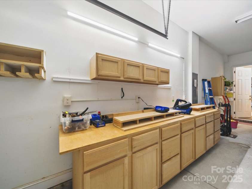 1004 Fairbanks Court, Indian Trail, NC 28079.  MLS# CAR4262755, YatesRealty ID 35214. Work station in garage