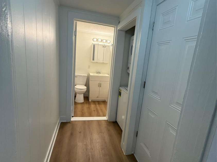276 Kathy Street, Marion, NC 28752.  MLS# CAR4399135, YatesRealty ID 35217. Hallway to back door, laundry, bathroom.