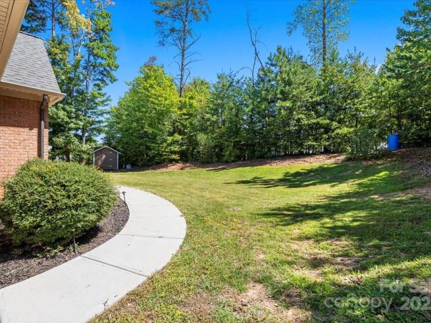 4038 Harmattan Drive, Denver, NC 28037.  MLS# CAR4297623, YatesRealty ID 35227. The flat backyard has plenty of room for a pool and play!
