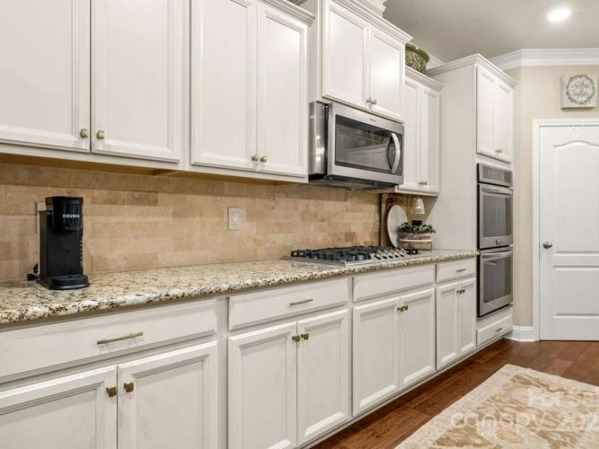 825 Spelman Drive, Indian Land, SC 29707.  MLS# CAR4289548, YatesRealty ID 35229. Kitchen, Gas Cooktop, Double Wall Oven + Microwave