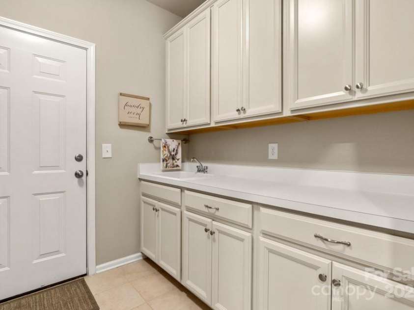 825 Spelman Drive, Indian Land, SC 29707.  MLS# CAR4289548, YatesRealty ID 35229. Laundry Room w/ Sink