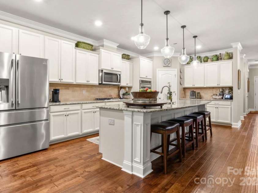 825 Spelman Drive, Indian Land, SC 29707.  MLS# CAR4289548, YatesRealty ID 35229. Open Kitchen w/ Island Bar + SS Appliances