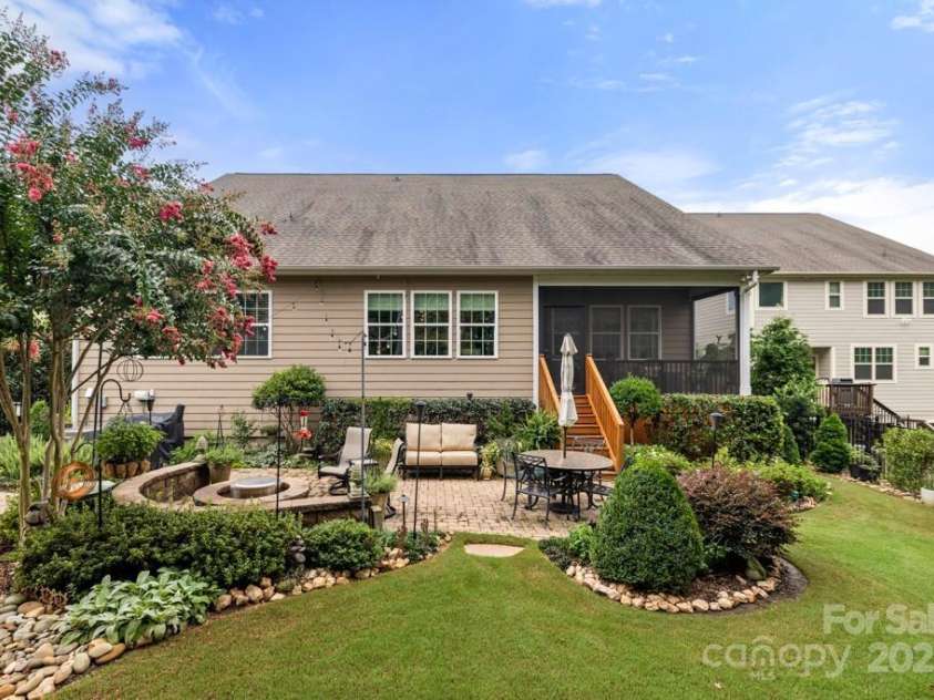 825 Spelman Drive, Indian Land, SC 29707.  MLS# CAR4289548, YatesRealty ID 35229. Rear Home/Yard with Paver Patio & Fire Pit