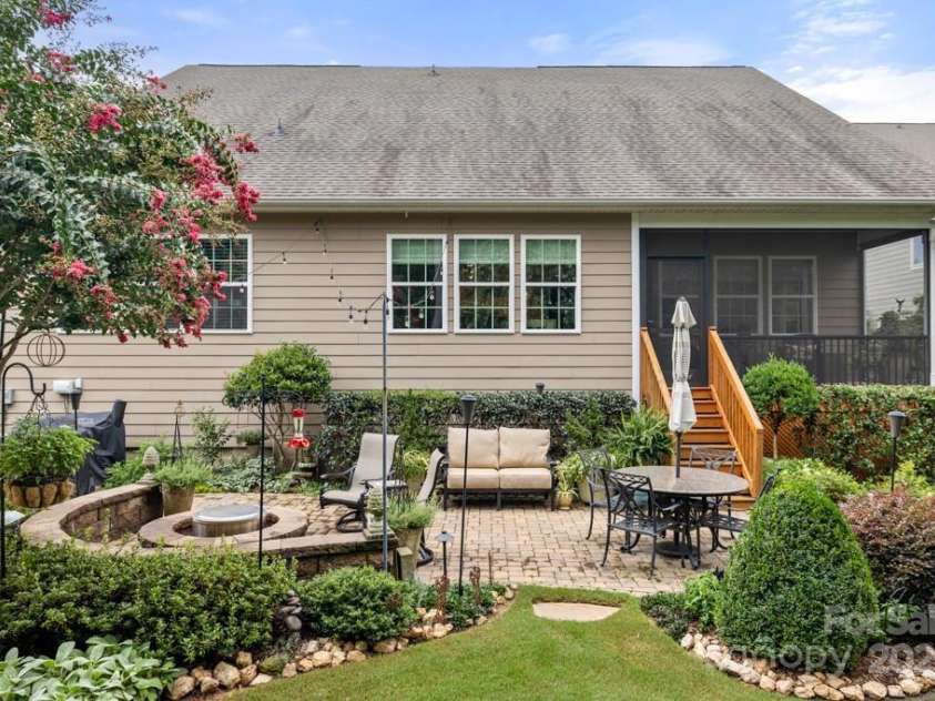 825 Spelman Drive, Indian Land, SC 29707.  MLS# CAR4289548, YatesRealty ID 35229. Rear Home/Yard with Paver Patio & Fire Pit