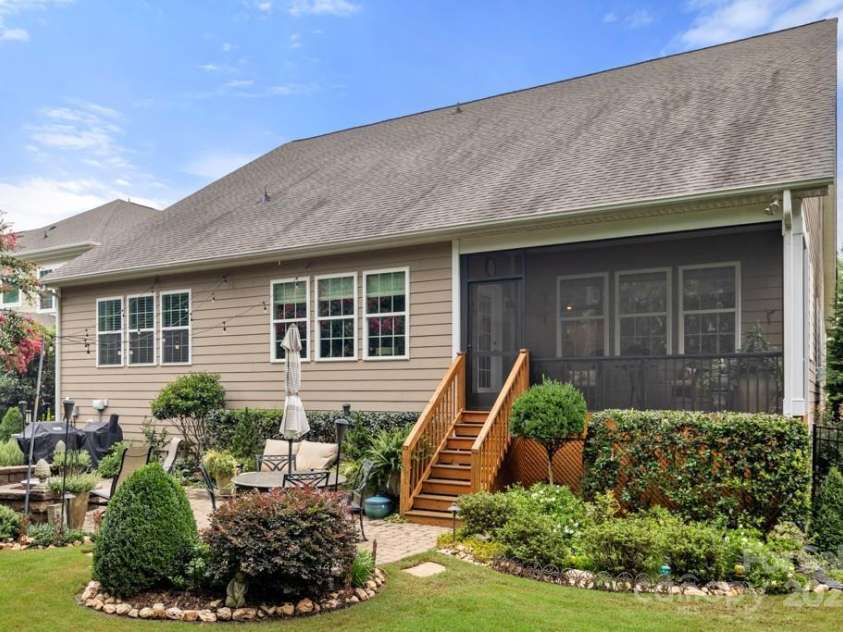 825 Spelman Drive, Indian Land, SC 29707.  MLS# CAR4289548, YatesRealty ID 35229. Rear of Home with Paver Patio and Screened-in Porch