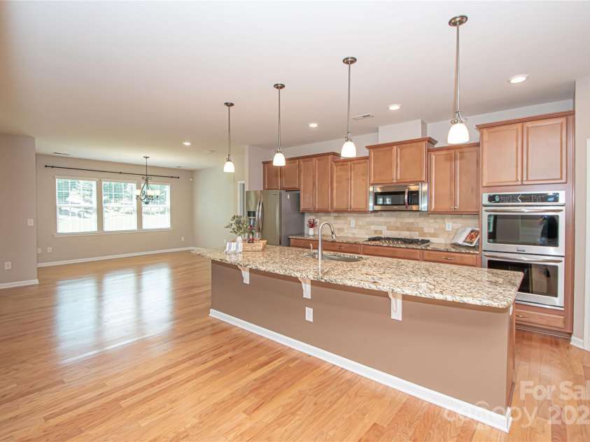 1045 Princeton Drive, Indian Land, SC 29707.  MLS# CAR4286861, YatesRealty ID 35232. Open-concept kitchen, family room, and in-kitchen dining