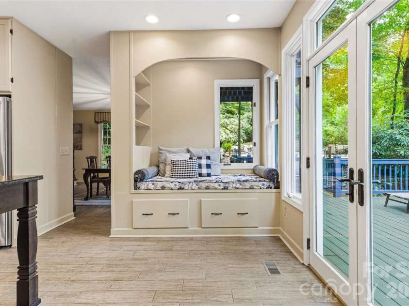 61 Scroops Drive, Swannanoa, NC 28778.  MLS# CAR4393585, YatesRealty ID 35237. Cozy nook in the kitchen with storage below.