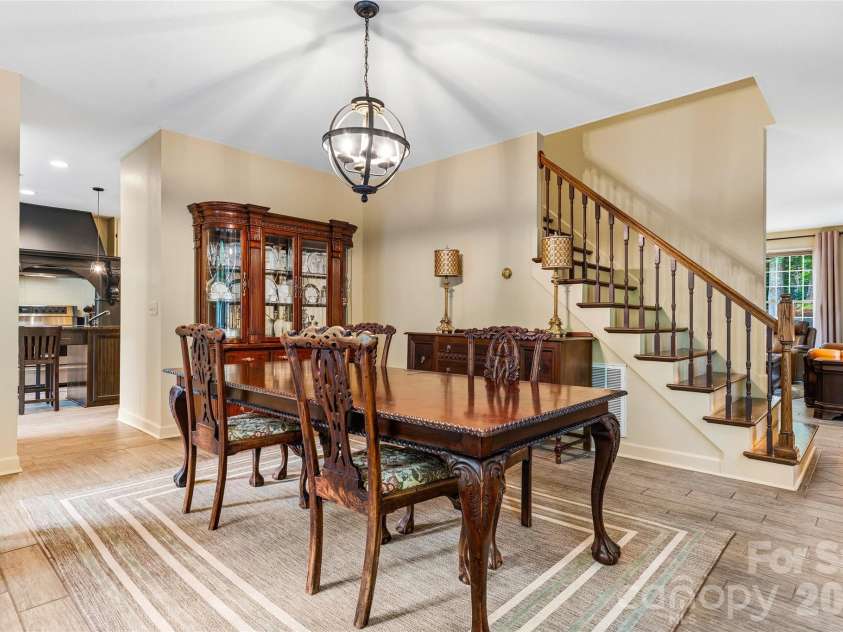 61 Scroops Drive, Swannanoa, NC 28778.  MLS# CAR4393585, YatesRealty ID 35237. Dining room with fireplace and gas logs.