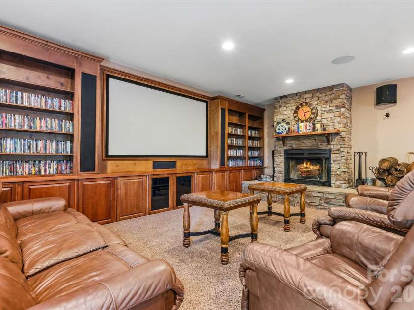 61 Scroops Drive, Swannanoa, NC 28778.  MLS# CAR4393585, YatesRealty ID 35237. Movie night by the fire.