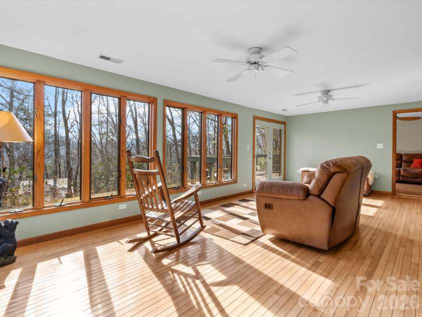 200 Canterbury Road, Cullowhee, NC 28723.  MLS# CAR4350143, YatesRealty ID 3524. Oversized sunroom with ample windows 