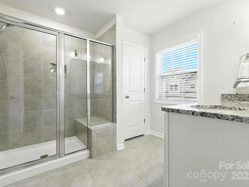 607 Santa Clara Drive, Asheville, NC 28806.  MLS# CAR4297182, YatesRealty ID 35241. Large walk in tiled shower