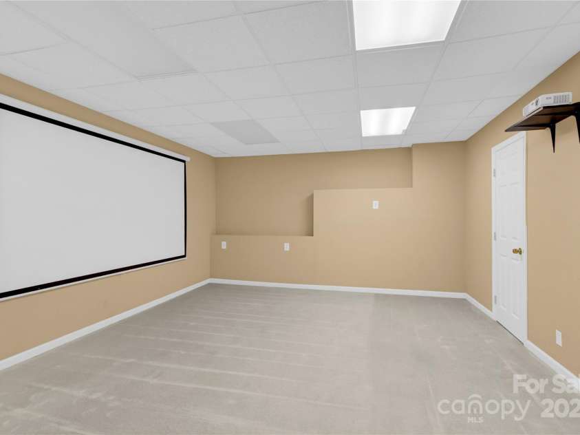 11201 Tavernay Parkway, Charlotte, NC 28262.  MLS# CAR4277991, YatesRealty ID 35248. Basement Theater