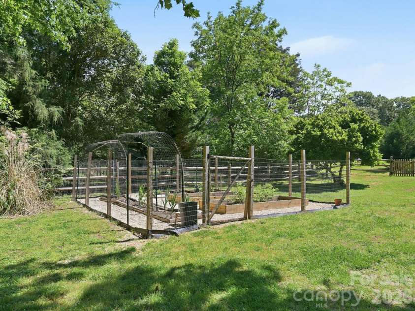 1203 Old Nation Road, Fort Mill, SC 29715.  MLS# CAR4376720, YatesRealty ID 35252. Vegetable and berry garden