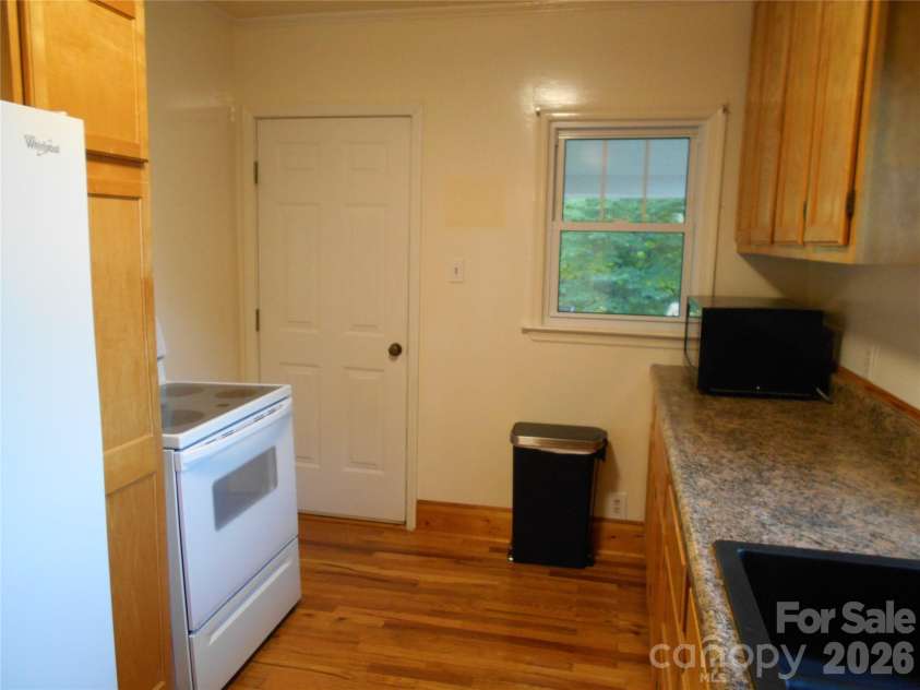 18 Herron Street, Black Mountain, NC 28711.  MLS# CAR4357548, YatesRealty ID 35259. Kitchen. Door opens to a larged covered patio