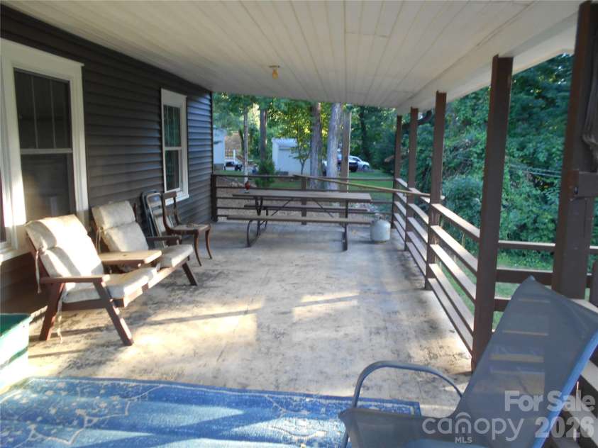 18 Herron Street, Black Mountain, NC 28711.  MLS# CAR4357548, YatesRealty ID 35259. Relaxing back covered patio just off the kitchen