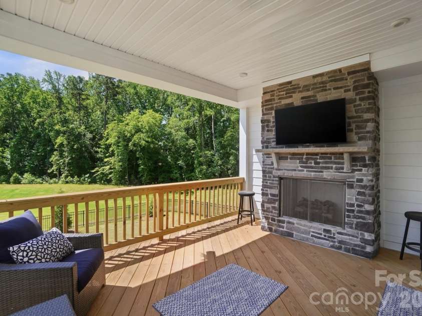 5225 Glenwalk Drive, Charlotte, NC 28269.  MLS# CAR4381104, YatesRealty ID 35264. Deck with fireplace