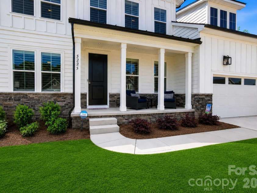 5225 Glenwalk Drive, Charlotte, NC 28269.  MLS# CAR4381104, YatesRealty ID 35264. Front view with porch
