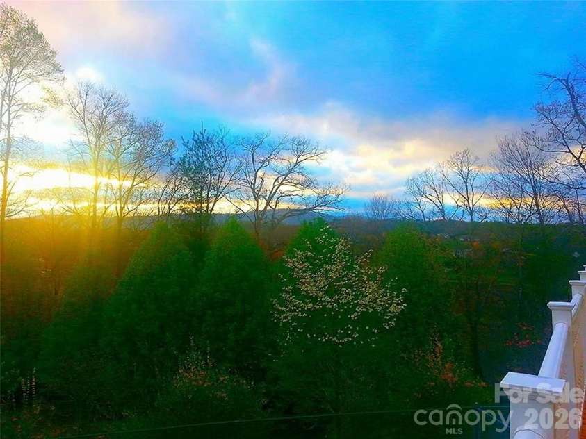 4901 Brevard Road, Horse Shoe, NC 28742.  MLS# CAR4355186, YatesRealty ID 3527. Sunset from Main House Deck