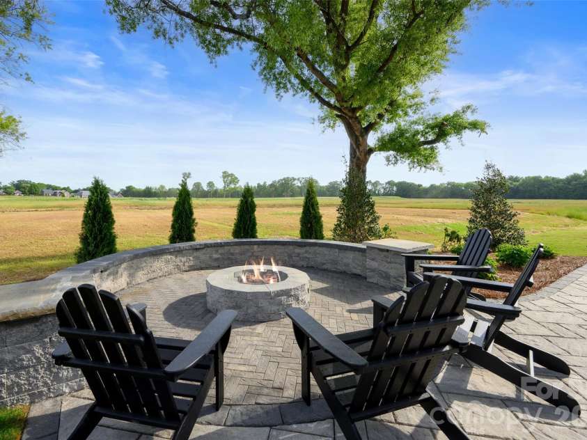 3244 Gavin Lane, Harrisburg, NC 28075.  MLS# CAR4391615, YatesRealty ID 35273. Custom Fire Pit