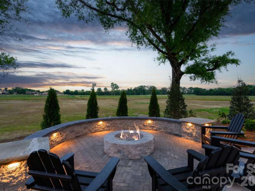 3244 Gavin Lane, Harrisburg, NC 28075.  MLS# CAR4391615, YatesRealty ID 35273. Custom Fire Pit