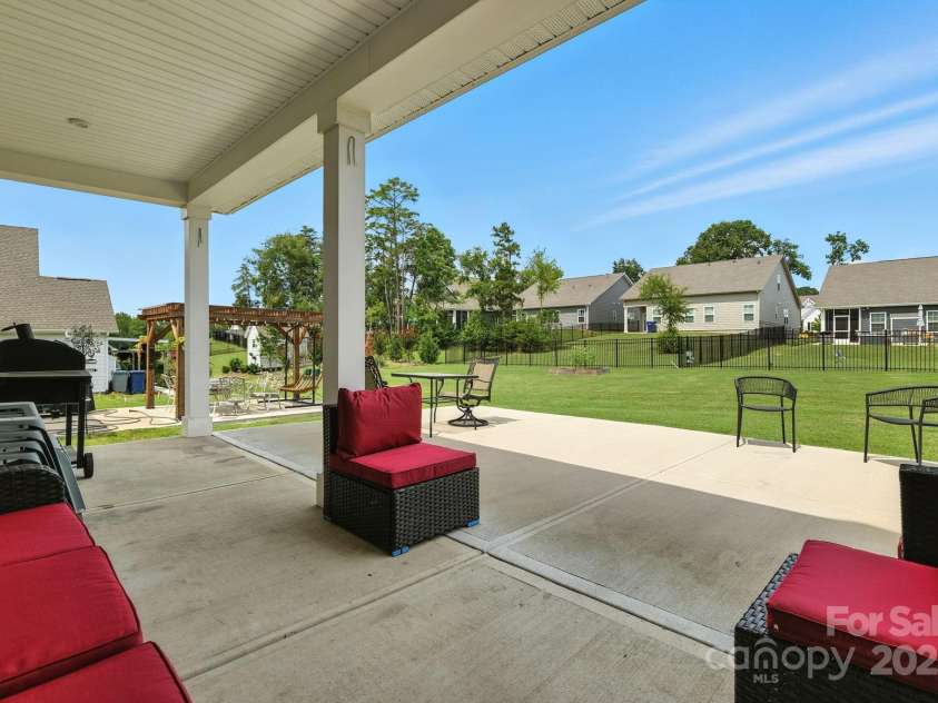 5112 Larewood Drive, Harrisburg, NC 28215.  MLS# CAR4297584, YatesRealty ID 35281. Approximately 22' x 12.5' Covered Porch with Approximately 22' x 9.5' Extended Patio