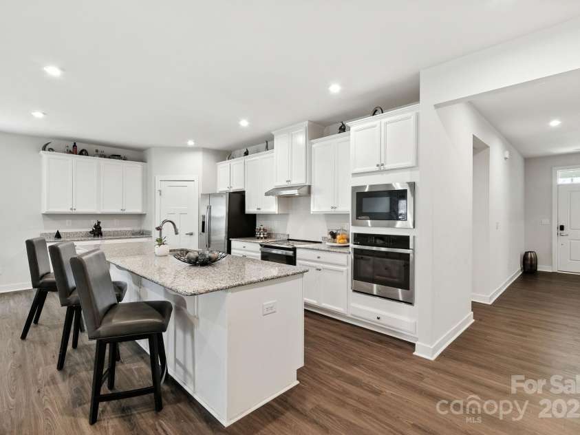 5112 Larewood Drive, Harrisburg, NC 28215.  MLS# CAR4297584, YatesRealty ID 35281. The Kitchen is the perfect hub for entertaining with its large kitchen island and separate serving area.