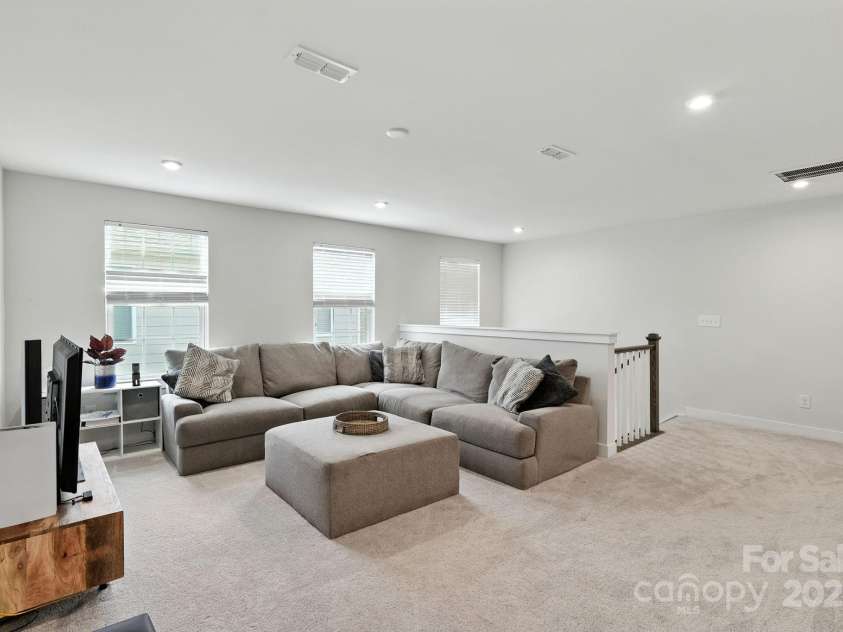 5112 Larewood Drive, Harrisburg, NC 28215.  MLS# CAR4297584, YatesRealty ID 35281. The Upper Family Room Loft is perfect for your guests to have their own space to chill.