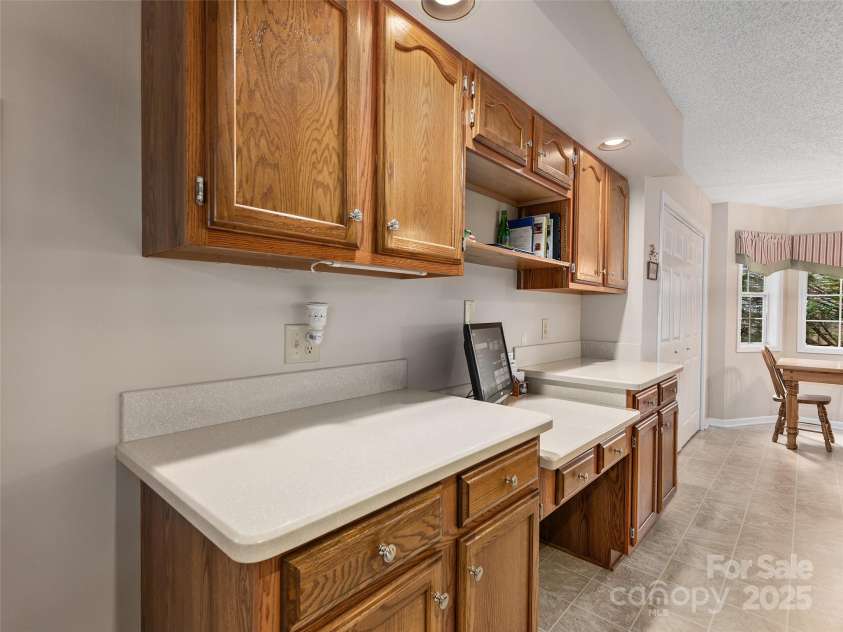 3 Wentworth Court, Etowah, NC 28729.  MLS# CAR4297402, YatesRealty ID 35283. Plenty of cabinets and a desk area