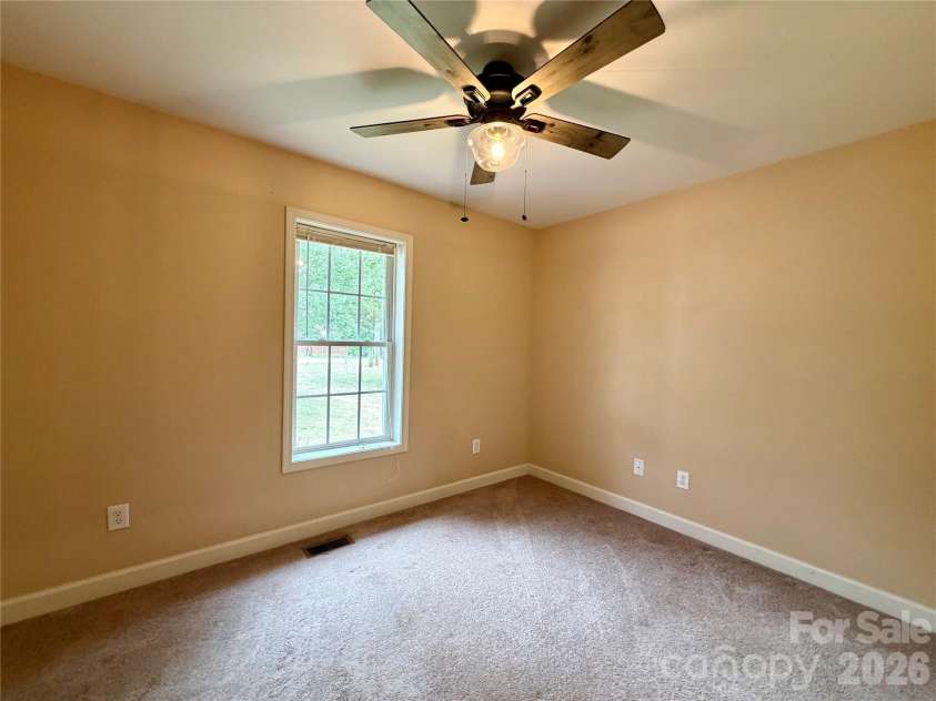 1027 Tabor Road, Olin, NC 28660.  MLS# CAR4399762, YatesRealty ID 35295. Front bedroom