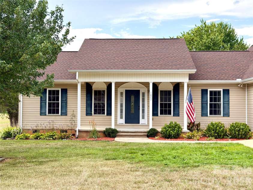 1027 Tabor Road, Olin, NC 28660.  MLS# CAR4399762, YatesRealty ID 35295. Front porch