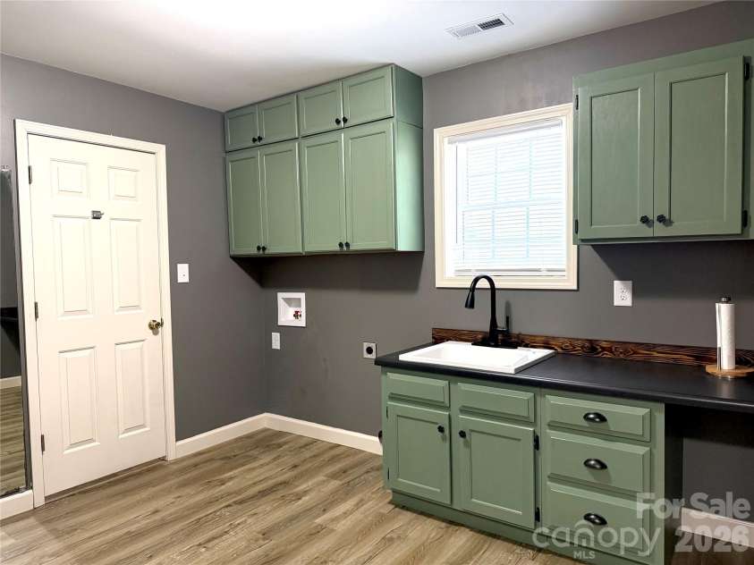 1027 Tabor Road, Olin, NC 28660.  MLS# CAR4399762, YatesRealty ID 35295. Laundry